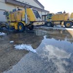 Home Comforts Framed Art for Your Wall Two Bright Yellow OshKosh Snow Removal Machines are Cleaned March 20, 2014, in Preparation for Their 10×13 Frame